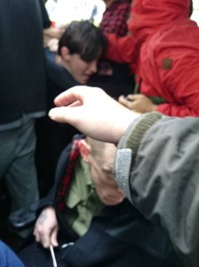 Disabled people fall against each other as police rush their wheelchairs